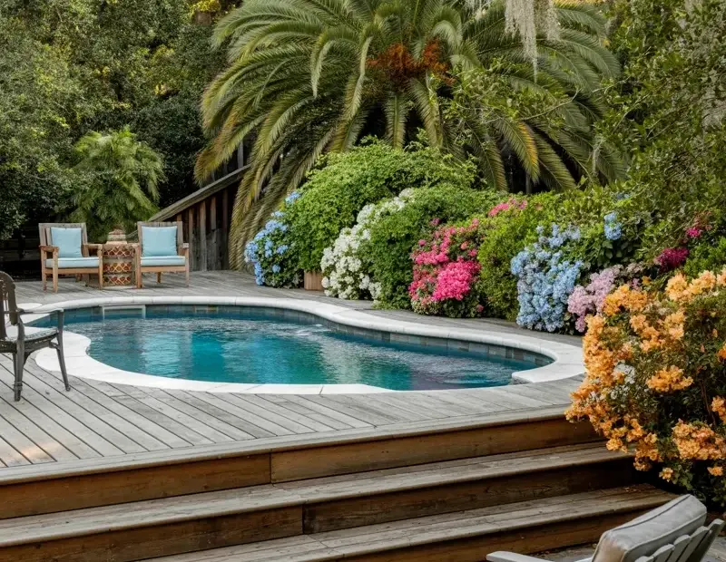 How to Plan a Backyard Pool with Wooden Deck and Stone Patio